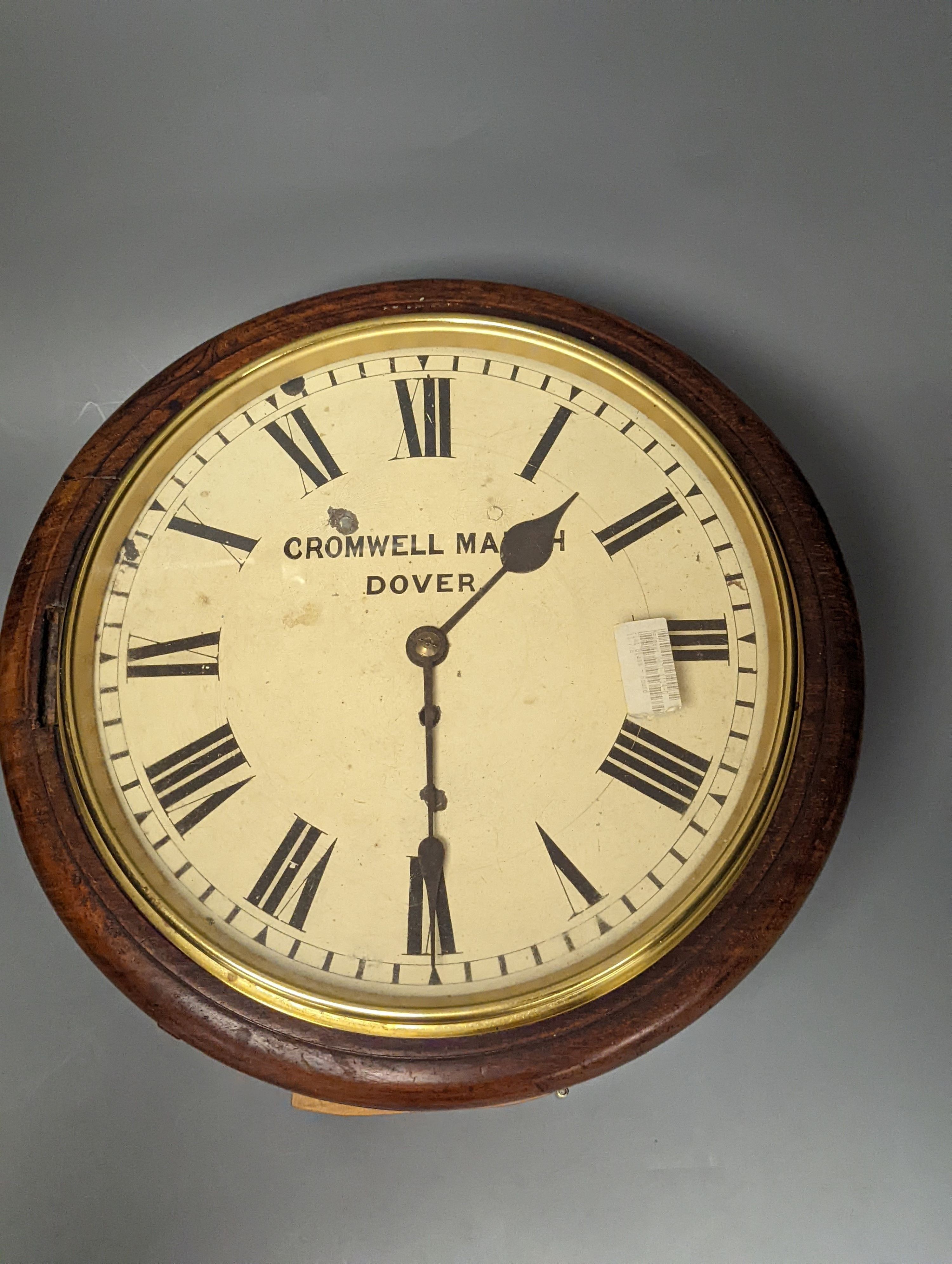 A Victorian mahogany dial timepiece, 37 cms diameter.